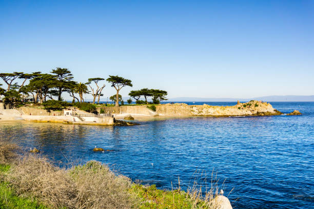 Lovers Point on a sunny and clear winter day, Pacific Grove, Monterey bay area, California Lovers Point on a sunny and clear winter day, Pacific Grove, Monterey bay area, California pacific grove stock pictures, royalty-free photos & images