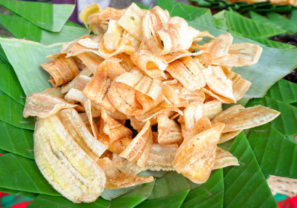 istock Fried banana slice crispy with sugar on banana leaf background 1135014029