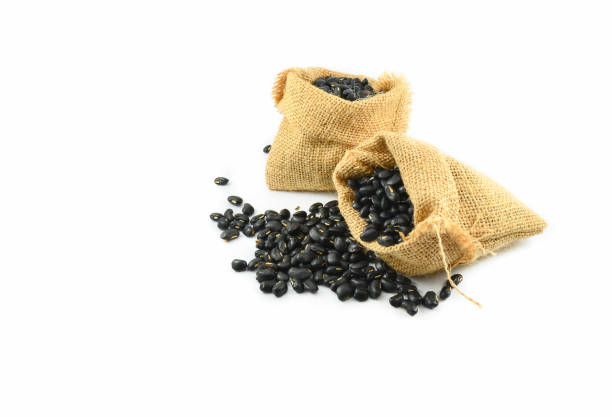 istock Black bean in sack isolated on white background 1135014072