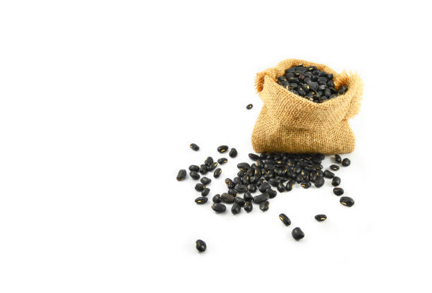istock Black bean in sack isolated on white background 1135014081