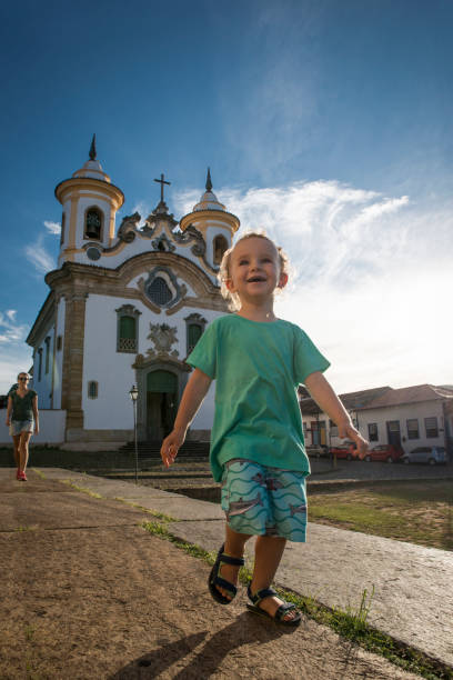 istock Boy smiling and running in Mariana church 1135015104