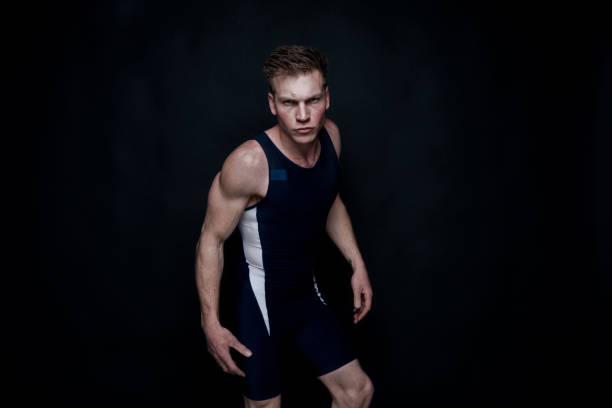 istock Sexy male wrestler on black background 1135016412