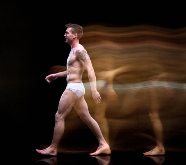 istock Man in underwear moving around creating a blur image 1135018056