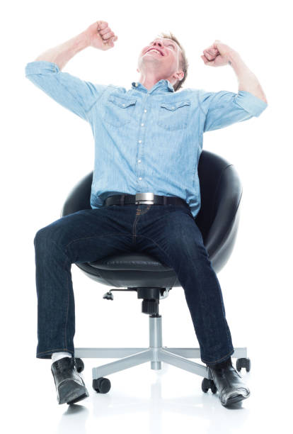 istock Happy seated man doing fist pump 1135019874