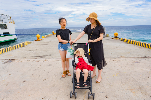 mother and daughters on the small wharf