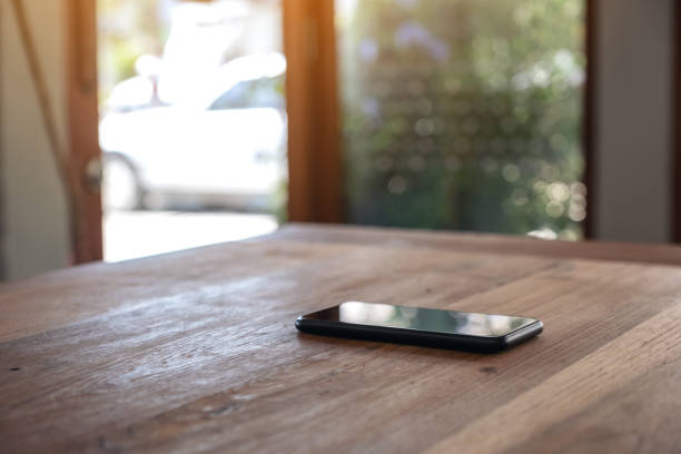 istock A single mobile phone on wooden table 1135024043