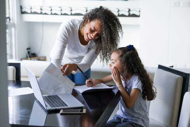 istock Mother and daughter do homework together 1135030307