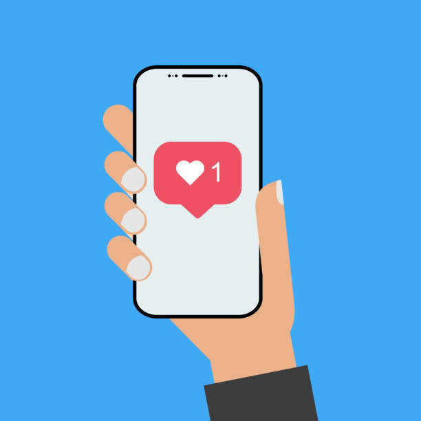 istock Modern design style hand holding the smartphone with new like screen 1135031240