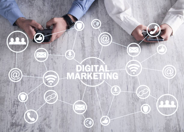 istock Two people using phone. Concept of Digital Marketing 1135032803