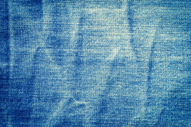 istock Denim blue jeans texture with space for text,  Indigo plain surface, Indigo classic vintage, Close-up of details of a pair of jeans trousers, Fabric Background 1135035041