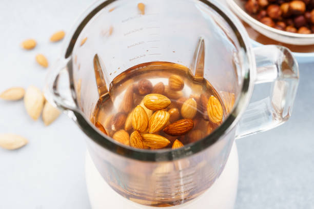 istock Blender with soaked almonds for making nut milk. 1135036100