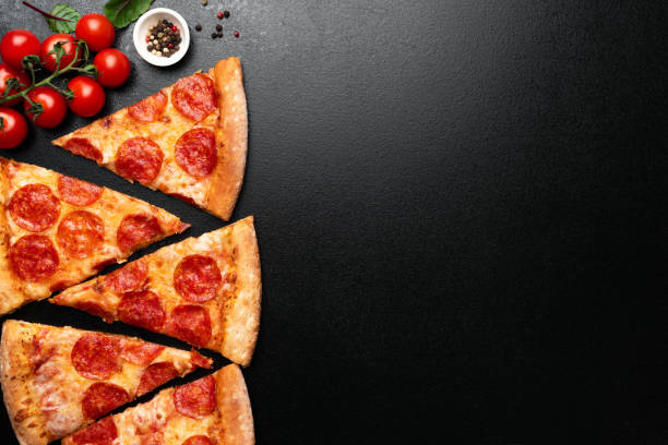istock Pepperoni Pizza Slices On Black Background 1135037020