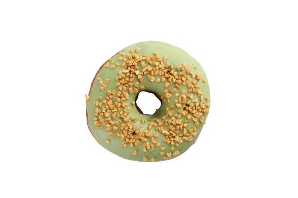 istock Appetizing donut with pistachios on a white background. Isolated. 1135041873