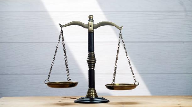 istock Law scales on table background. Symbol of justice 1135046264