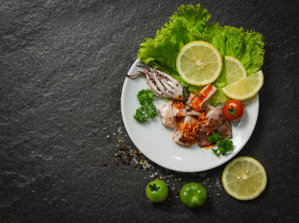 istock Squid salad plate served with chilli sauce spicy herbs and spices 1135046792