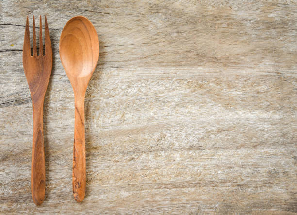 istock Wooden spoon and fork kitchenware set on wooden table / Zero waste use less plastic concept 1135046829