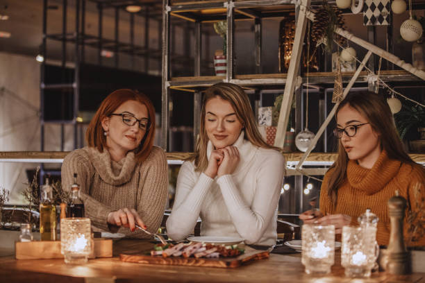 istock Mother and daughters having delicious appetizer 1135047805