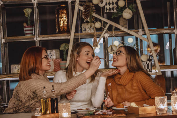 istock Mother feeding daughter with appetizer 1135047816