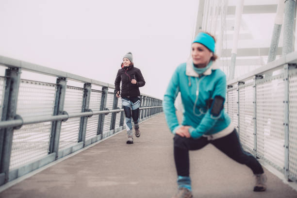 istock Runners exercising on a cold winter day 1135048869