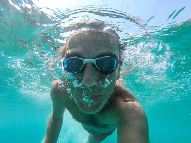 istock Underwater view of a diver man swimming 1135049191