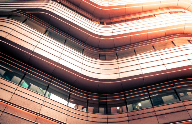Low angle colour image depicting an abstract view of modern architecture built from glass and steel in the heart of the city of London, UK. Plenty of room for copy space.