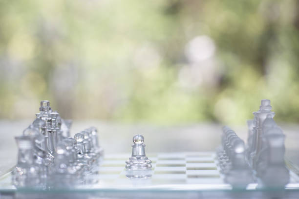 Chess board game made of glass, business competitive concept, copy space