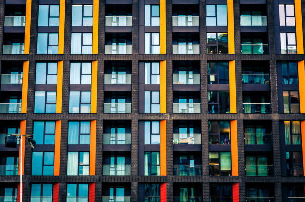 Abstract Futuristic Modern Architecture in the City Low angle colour image depicting an abstract view of modern architecture built from glass and steel in the heart of the city of London, UK. Plenty of room for copy space. architecture capital cities glass pattern stock pictures, royalty-free photos & images