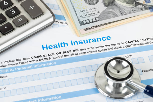 istock Health insurance application form with stethoscope and calculator 1135051264