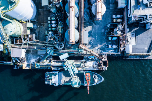 istock Oil refinery storage units with tanker ships 1135051348