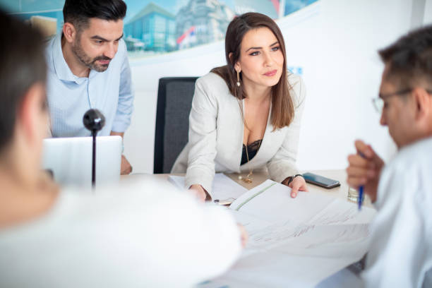 istock Businesspeople listening colleague analyizing chart 1135052531