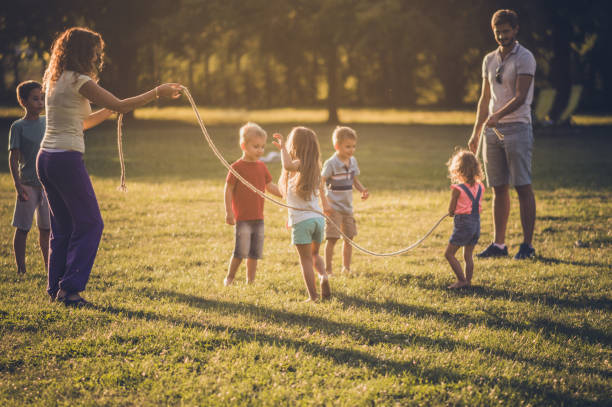 istock Group of children playing in public park 1135056740