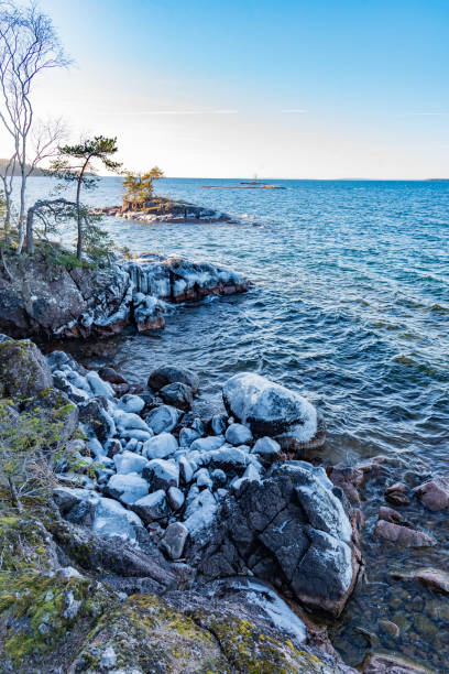 istock overlooking icy rocks on a lake shore 1135057527