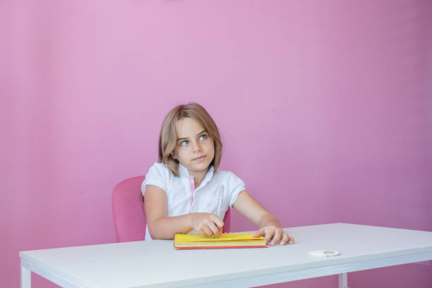 istock Child girl studying and researching 1135057686