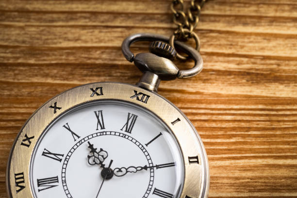 istock Vintage pocket watch clock on wooden background 1135057868