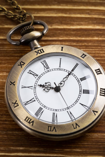 istock Vintage pocket watch clock on wooden background 1135057871