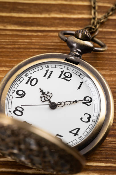 istock Vintage pocket watch clock on wooden background 1135057876