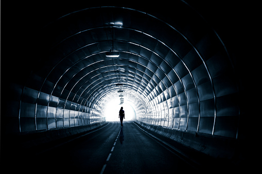 Dark tunnel with silhouette