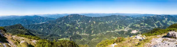 Panoramic view from summit of mountain Hochlantsch over the valley to mountain Rennfeld in Styria, Austria