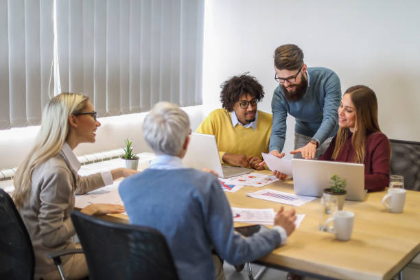 istock Multi-generation and ethnic group of colleagues at meeting 1135061504