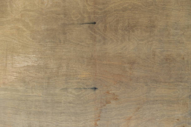 istock old plywood texture abstract background with stain. 1135063119