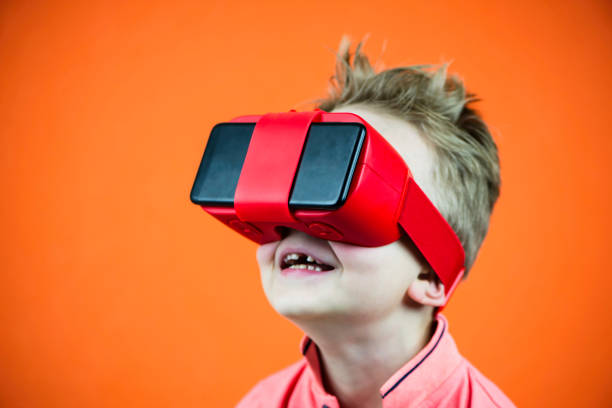 istock funny boy in virtual reality glasses playing smartphone 1135063161