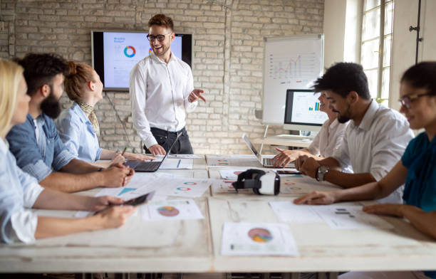 istock Business, technology and people concept - creative team or designers working in office 1135065868