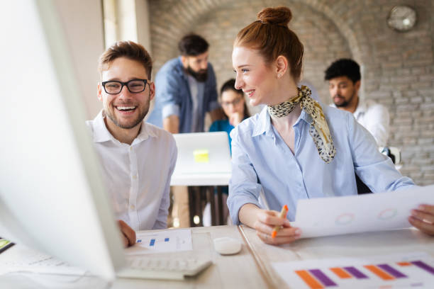istock Successful happy group of people learning software engineering and business during presentation 1135066581