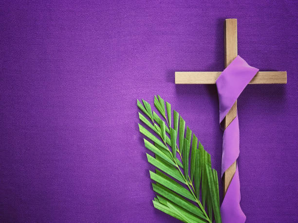 Good Friday, Lent Season and Holy Week concept. A religious cross and palm leaves on purple background. pilgrimage photos stock pictures, royalty-free photos & images