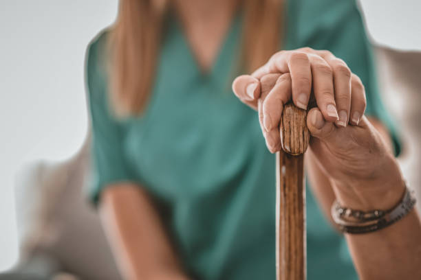 istock Caregiver's hand on elder's hand 1135068157