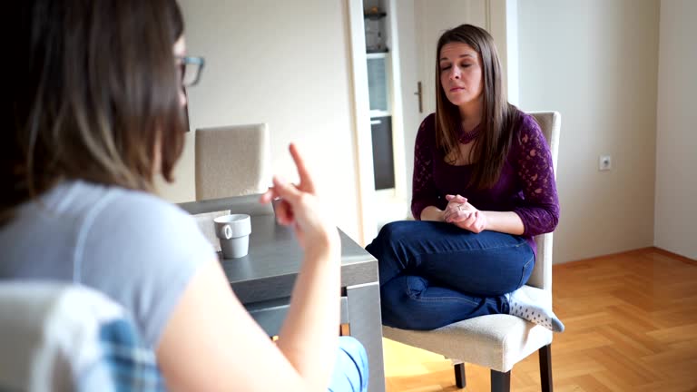 Confident mid adult woman using sign language