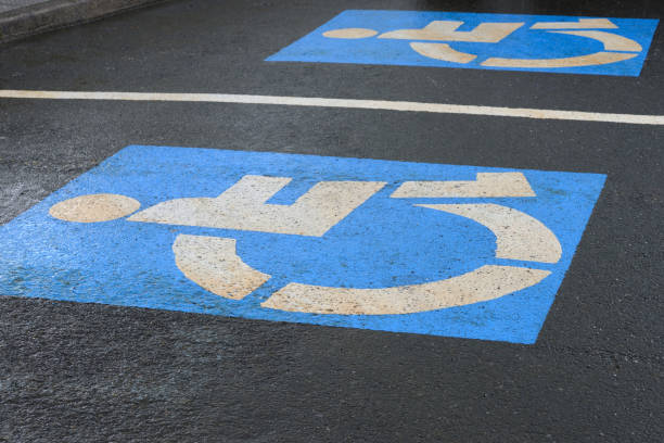 istock sign on asphalt parking for the disabled, close-up 1135069941
