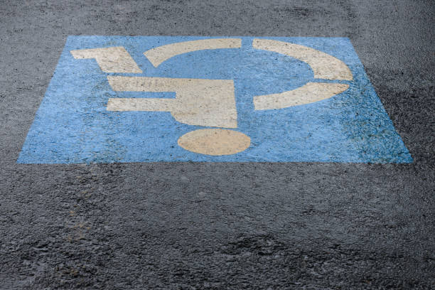 istock sign on asphalt parking for the disabled, close-up 1135070029