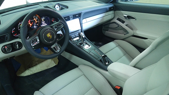 Moscow. February 2018. Porsche 911 991 Turbo Gray interior with pcm 4, analog clocks and keyless. Steering wheel with sport responce