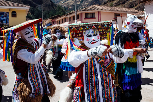 masked dancers on assumption day in Coya stock photo